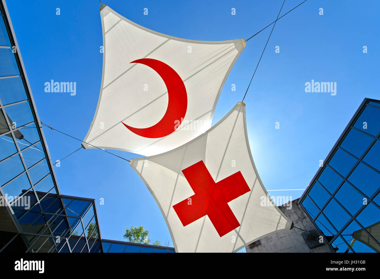 Red Cross flag and flag of the Red Crescent, International Red Cross and Red Crescent Museum, Geneva, Switzerland Stock Photo
