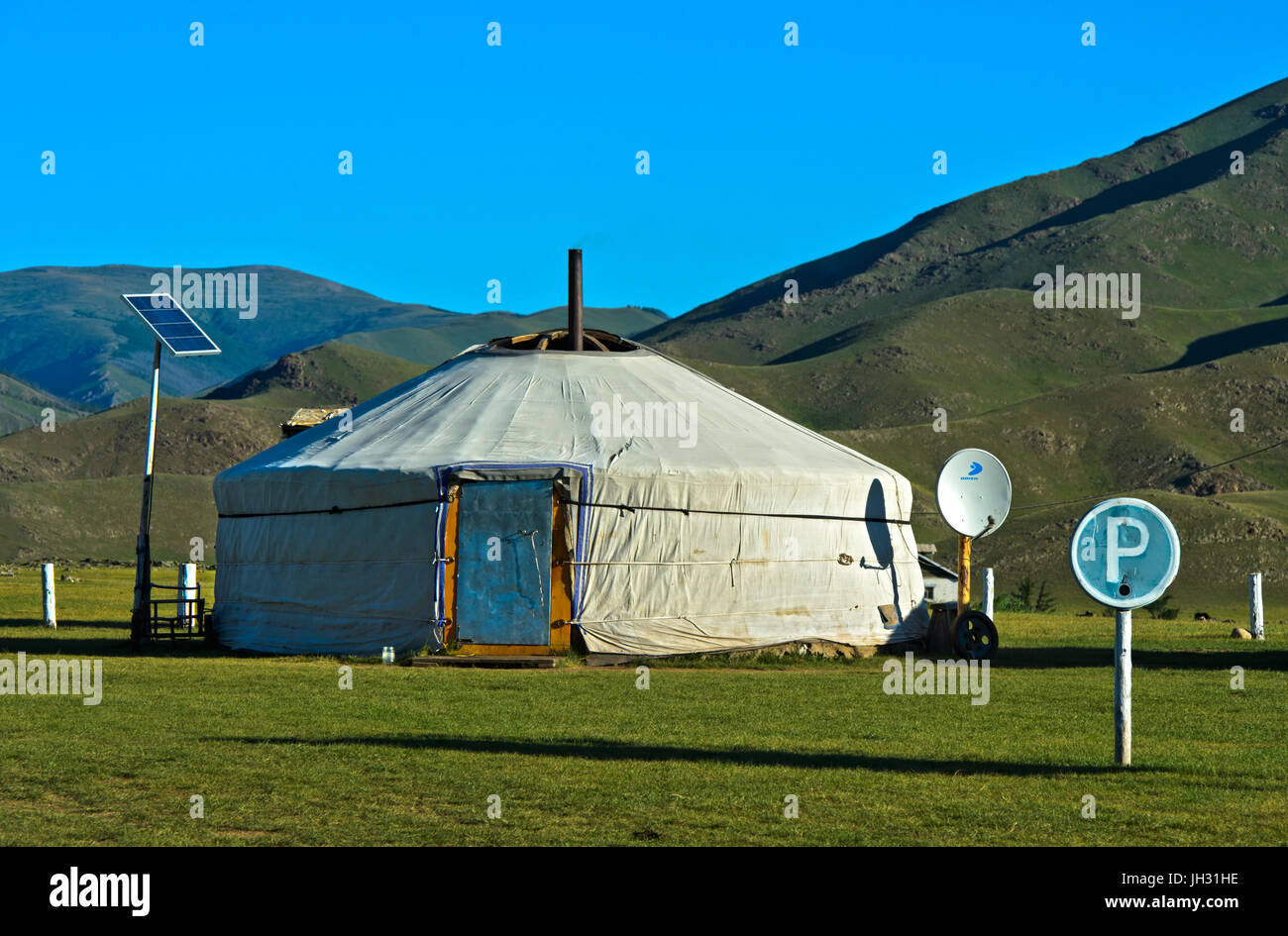 Modern yurt with solar panel, satellite dish and parking lot, Orkhon Valley, Mongolia Stock Photo