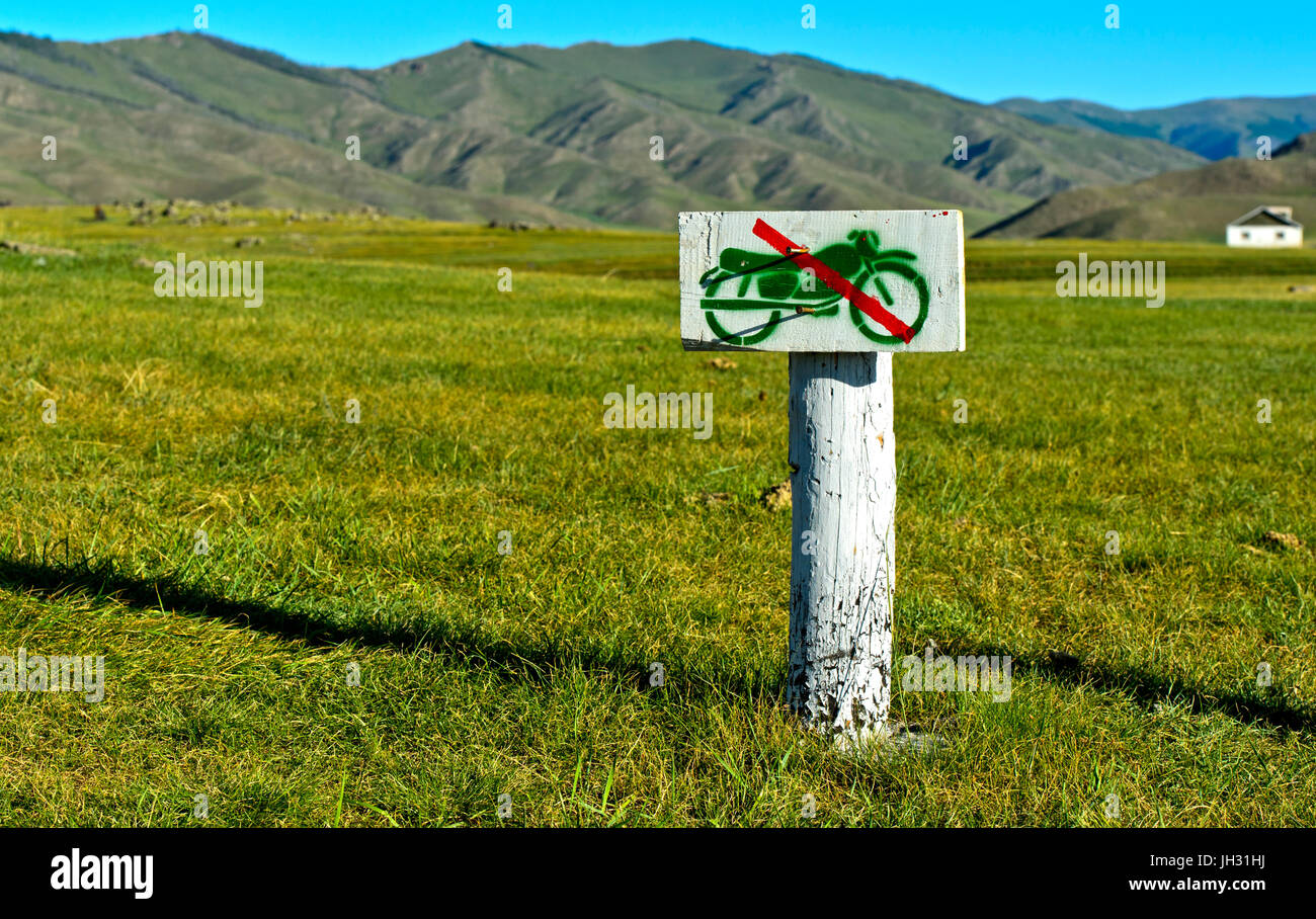 Hand-made sign banning motor-cycles in the Mongolian steppe, Orkhon Valley, Mongolia Stock Photo