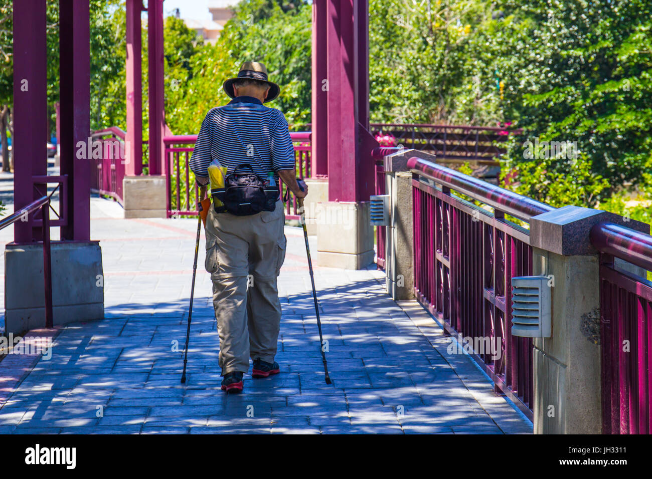 Senior Man With Fannypack & Walking Poles Stock Photo