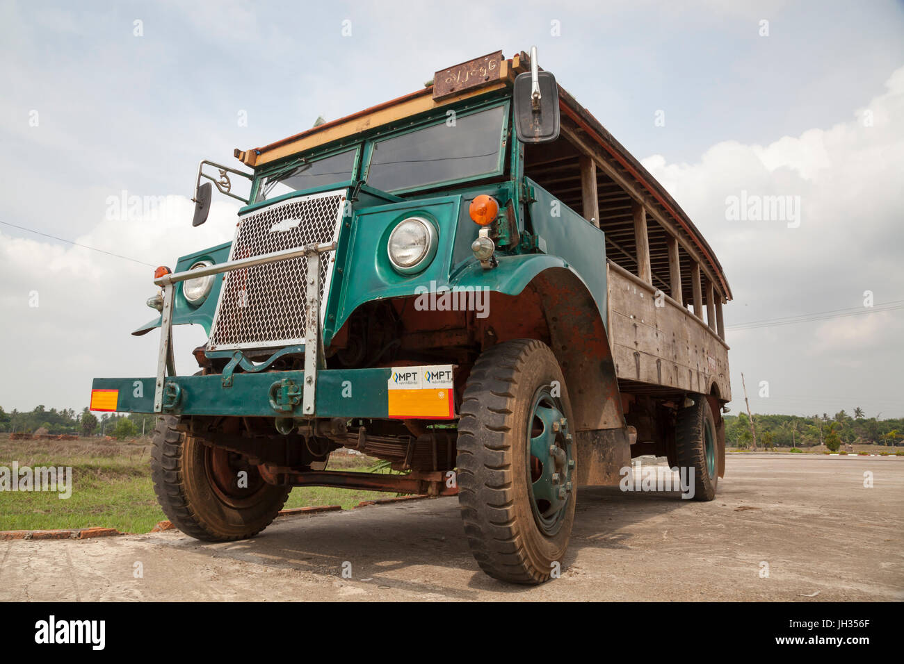 Vintage bus still in use in Myanmar. Modified from a WW2 ex British army Canadian Military Pattern Chevrolet C60 truck. Mon State, Myanmar Stock Photo