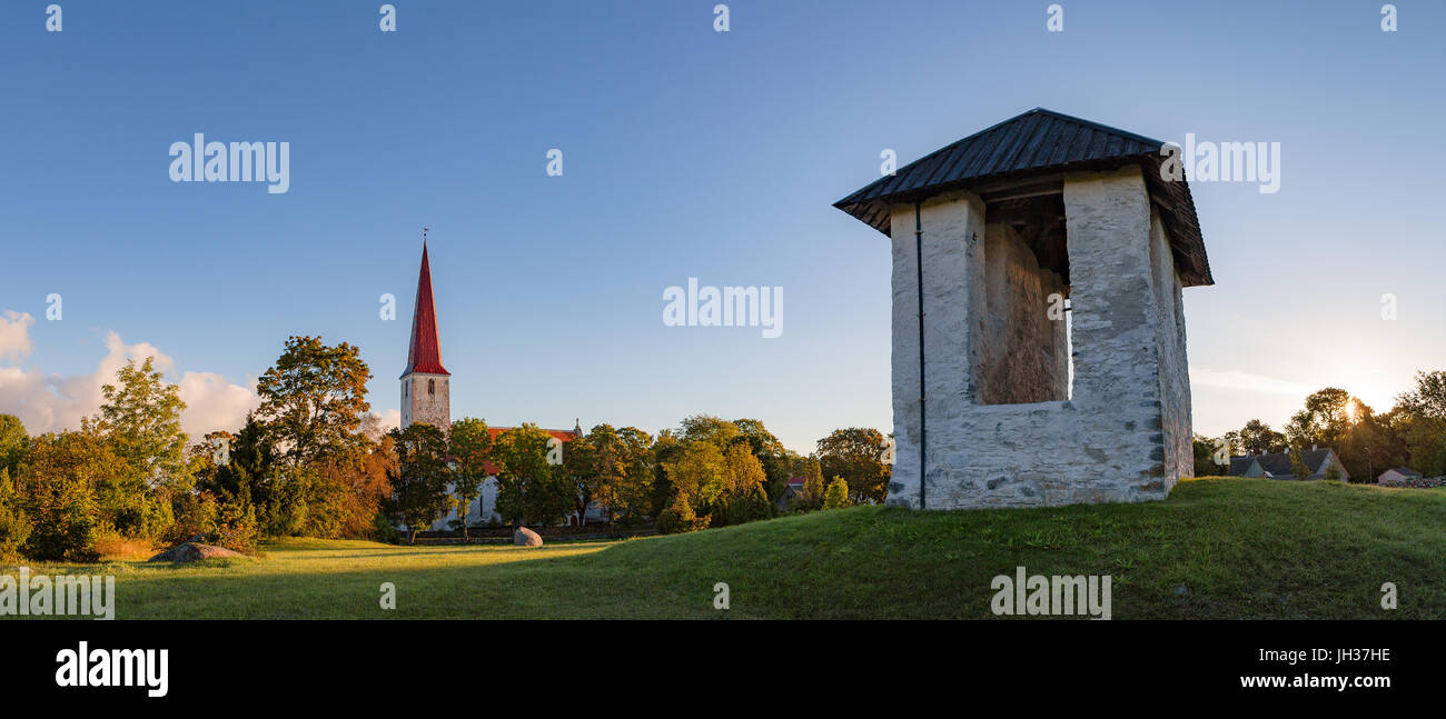 Bellfry and ancient Lutheran church in Kihelkonna, Saaremaa, Estonia. Early autumn sunny day. Stock Photo