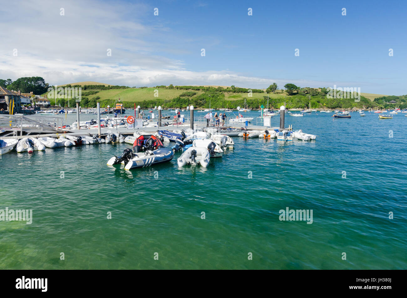 Numerous inflatable dinghies tied up on pontoons in Salcombe, Devon Stock Photo