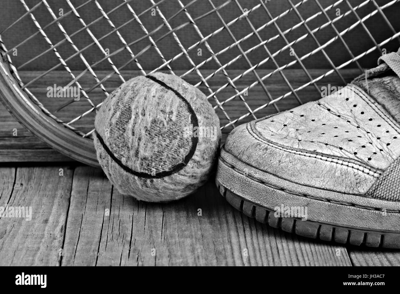 Old Racket Ball old tennis ball and racket with sneakers on a wooden floor Stock Photo ...