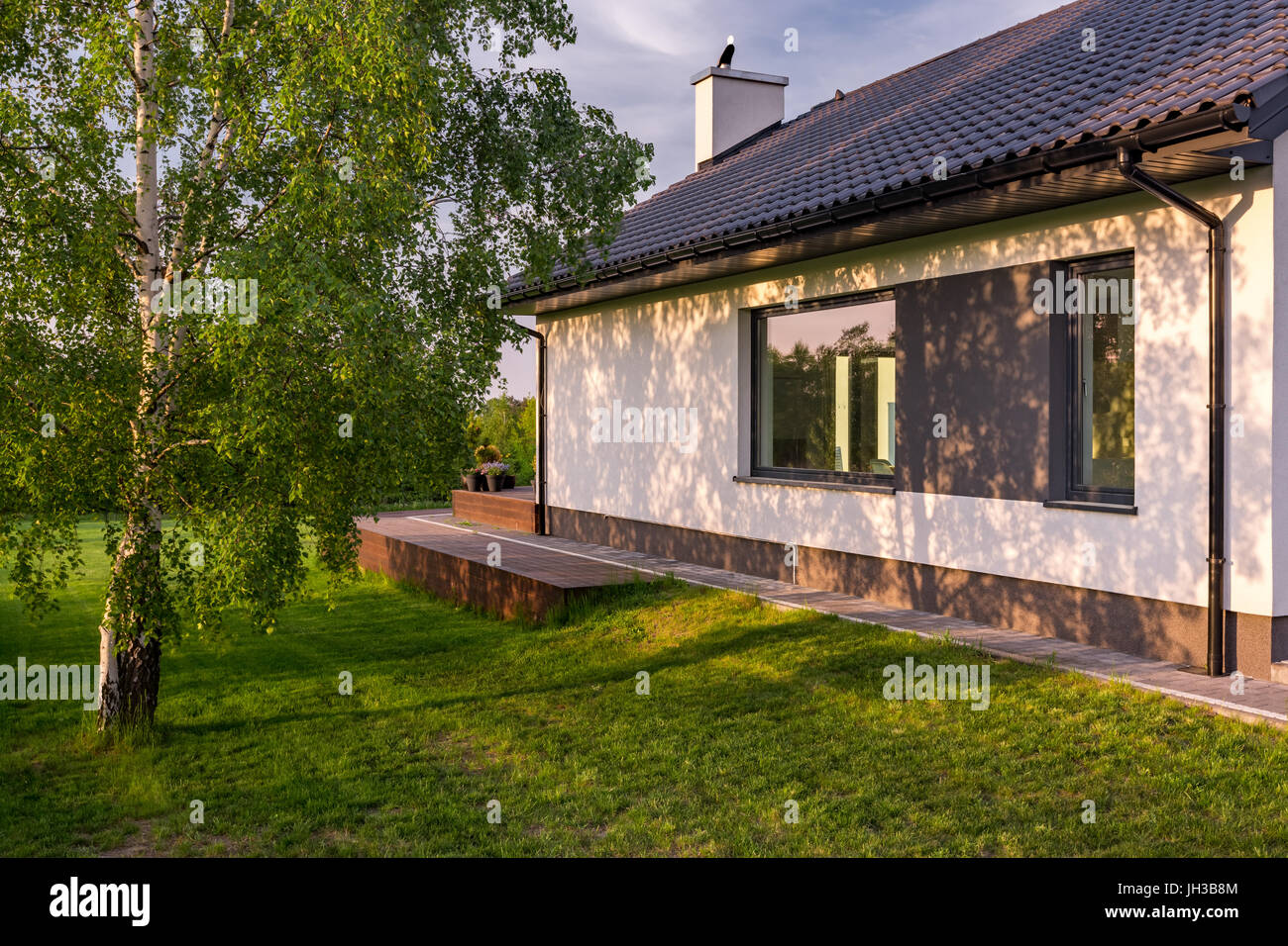 Cozy house green roof hi-res stock photography and images - Alamy