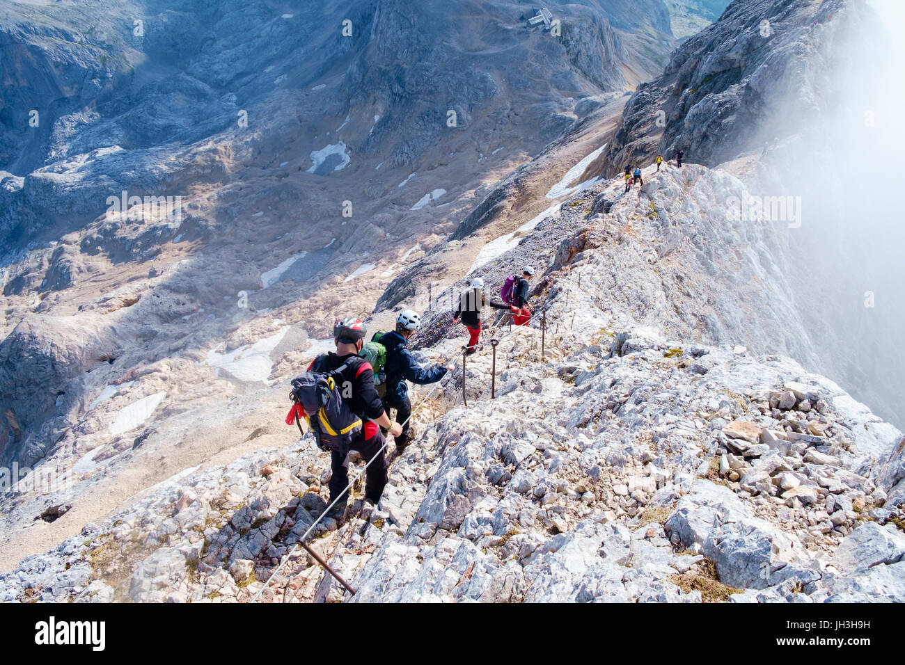 Mt. Triglav Slovenia - September 3, 206: Climbers progresssing on the climb to the top of mt Triglav. Stock Photo