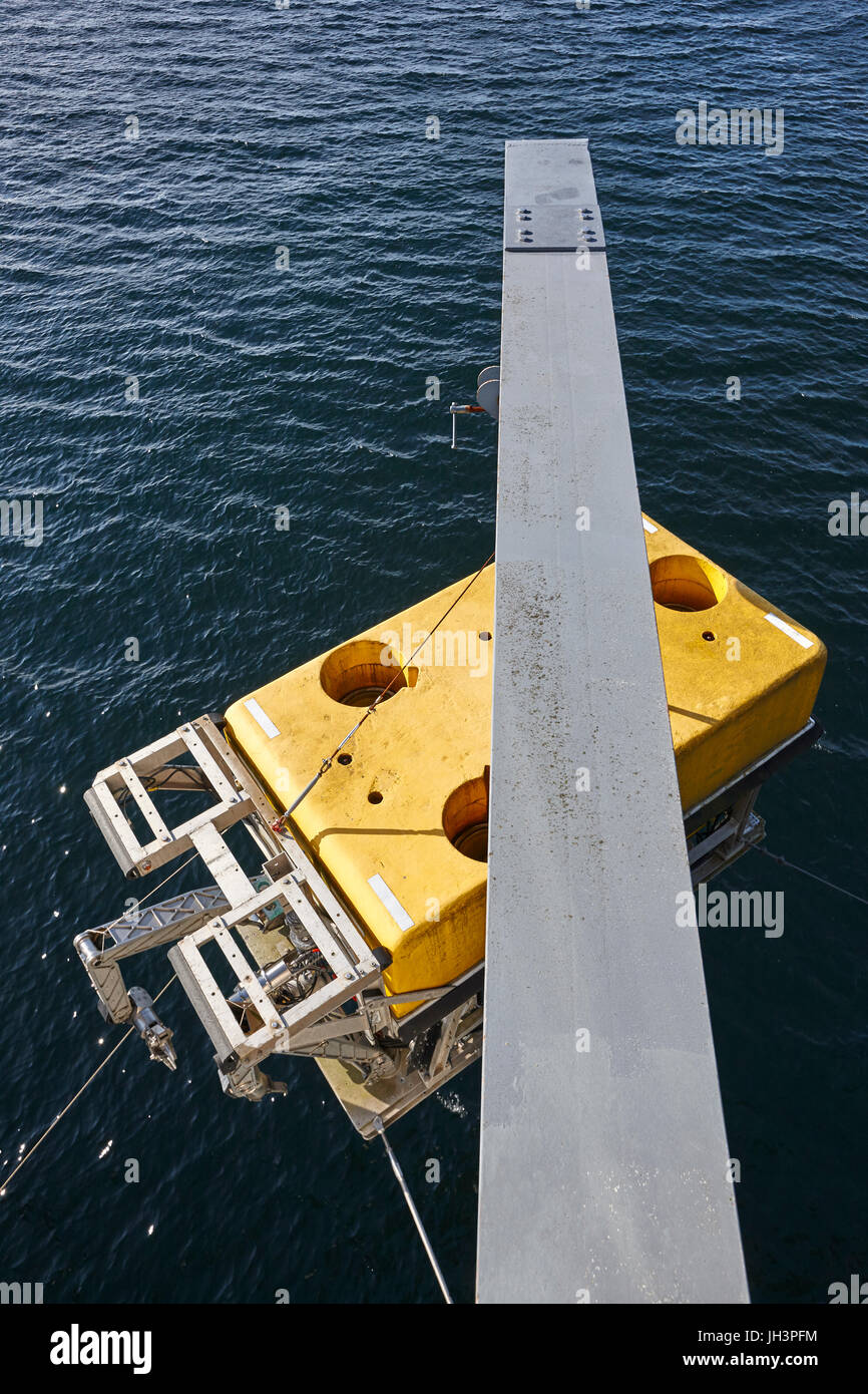 Scientific submarine robot with crane ready to be submerged. Research Stock Photo