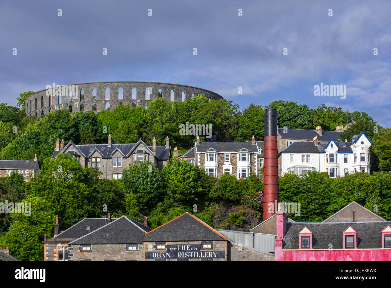 Oban Distillery and McCaig's Tower on Battery Hill overlooking the city
