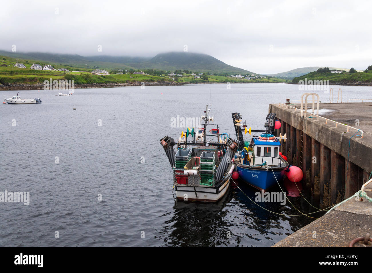 Inshore fishing vessels at Teelin pier harbour, County Donegal, Ireland Stock Photo
