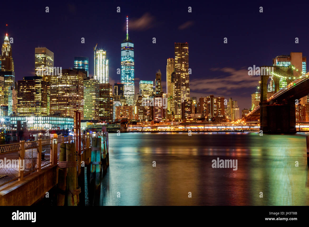 Night view of Brooklyn bridge and Skyscrapers in New York Night Brooklyn Bridge Stock Photo