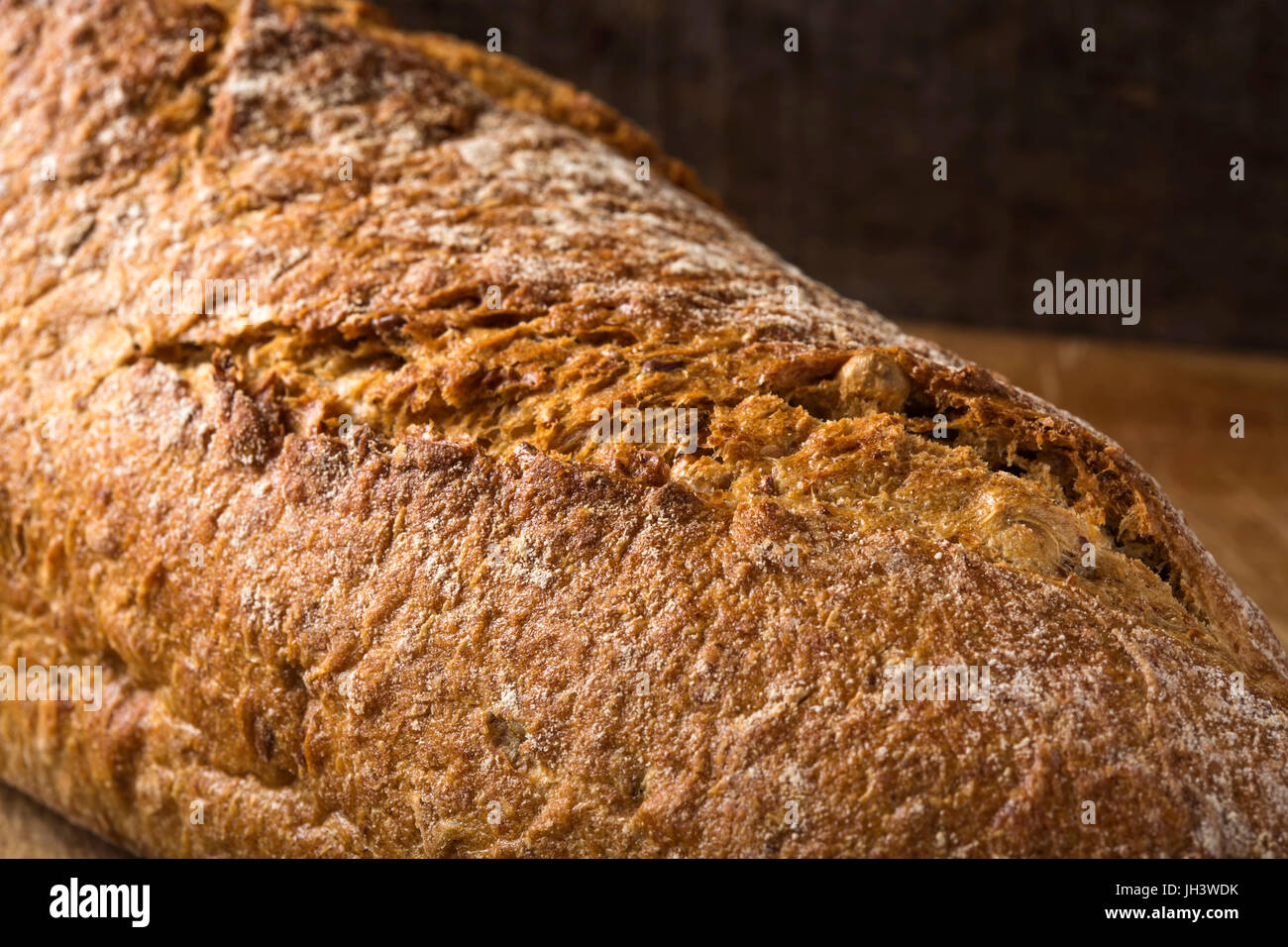 Close-up of freshly baked homemade bread on rustic background Stock Photo