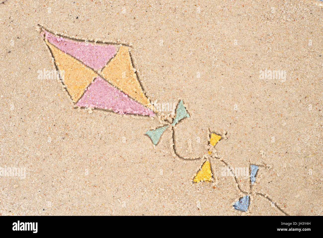 kite drawing in sand background Stock Photo