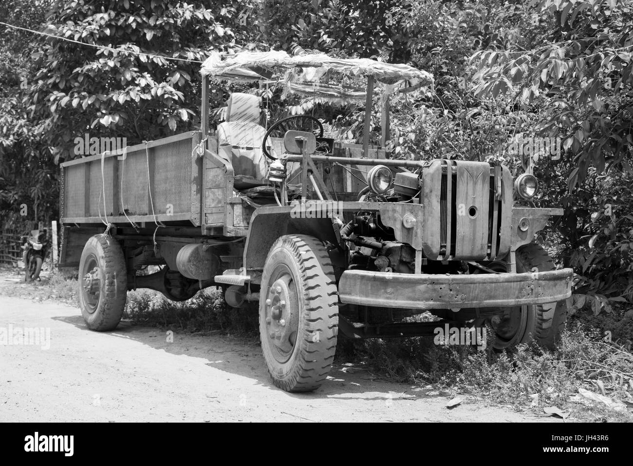 Vintage truck still in widespread use today in Myanmar. Modified from a ...