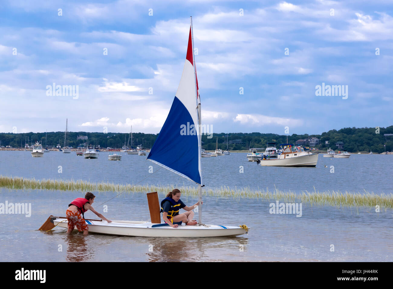 Young teens on sailboat. Stock Photo