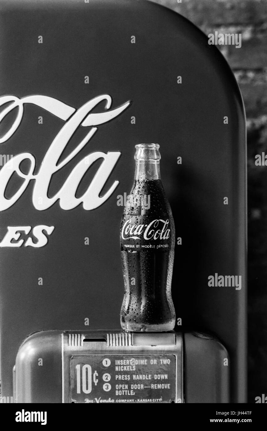 1950's coke machine with bottle Stock Photo