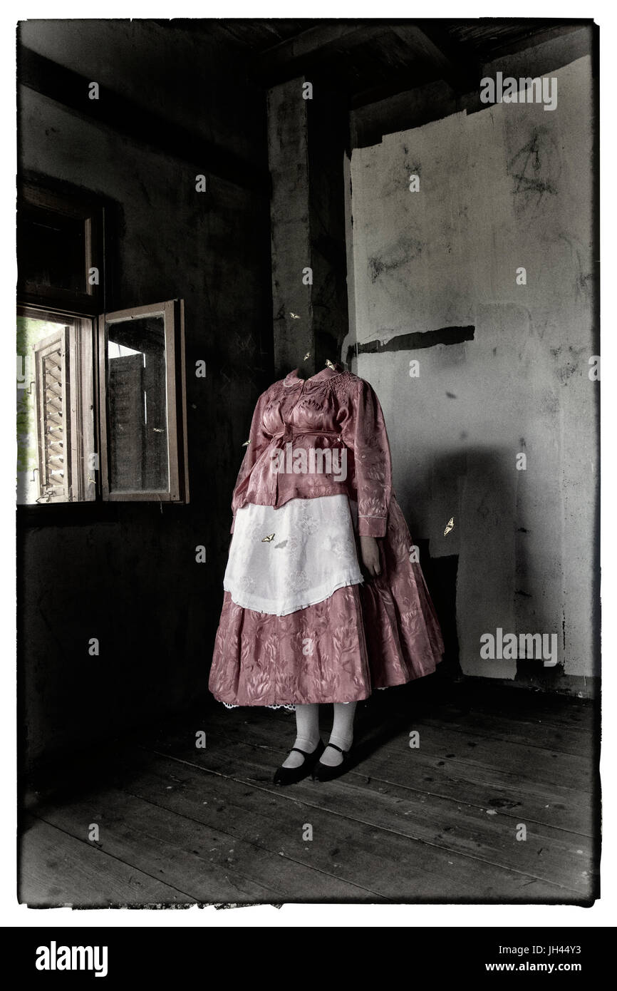 Mixed media artwork. Headless woman standing in the dark room, next to a window, wearing a folk costume, surrounded by butterflies. Creepy atmosphere. Stock Photo