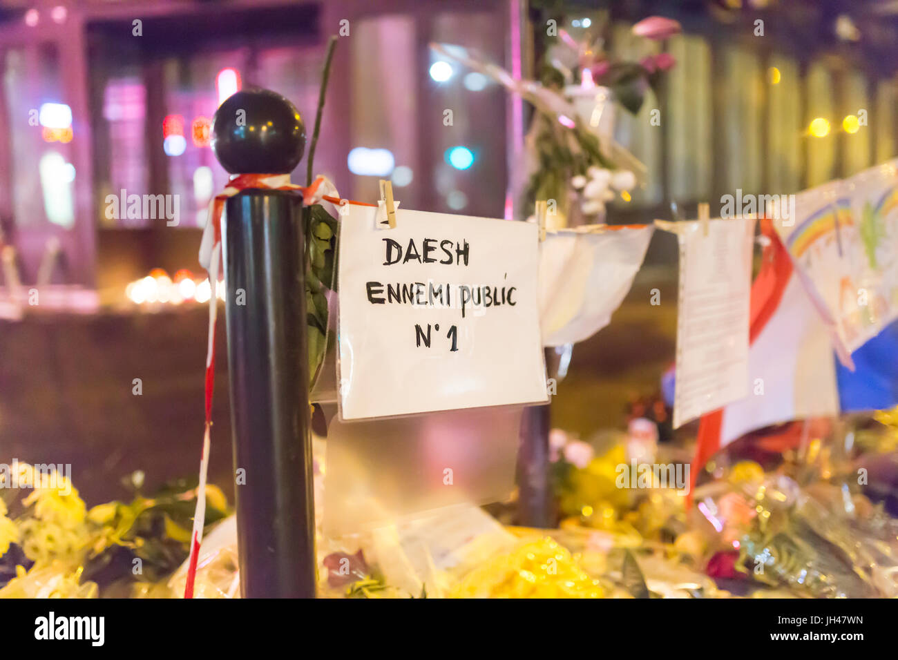 slogan: daesh, ennemi public n°1. Spontaneous homage at the victims of the terrorist attacks in Paris the 13th of november 2015. Stock Photo