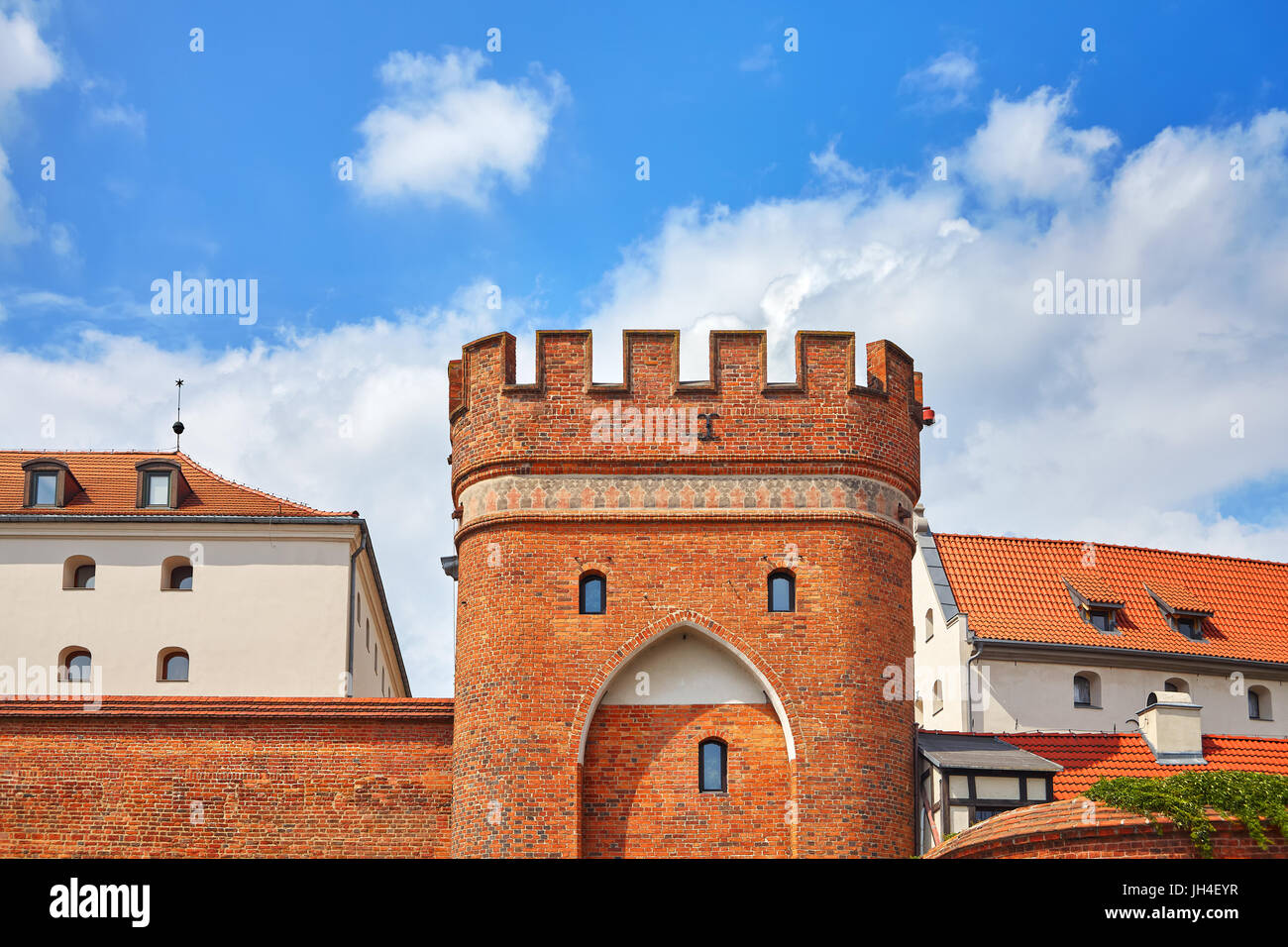Bridge Gate to the Old Town in Torun, medieval city wall fortification, Poland. Stock Photo