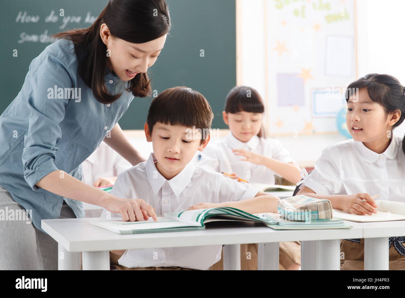 The teachers and pupils are in the classroom Stock Photo - Alamy