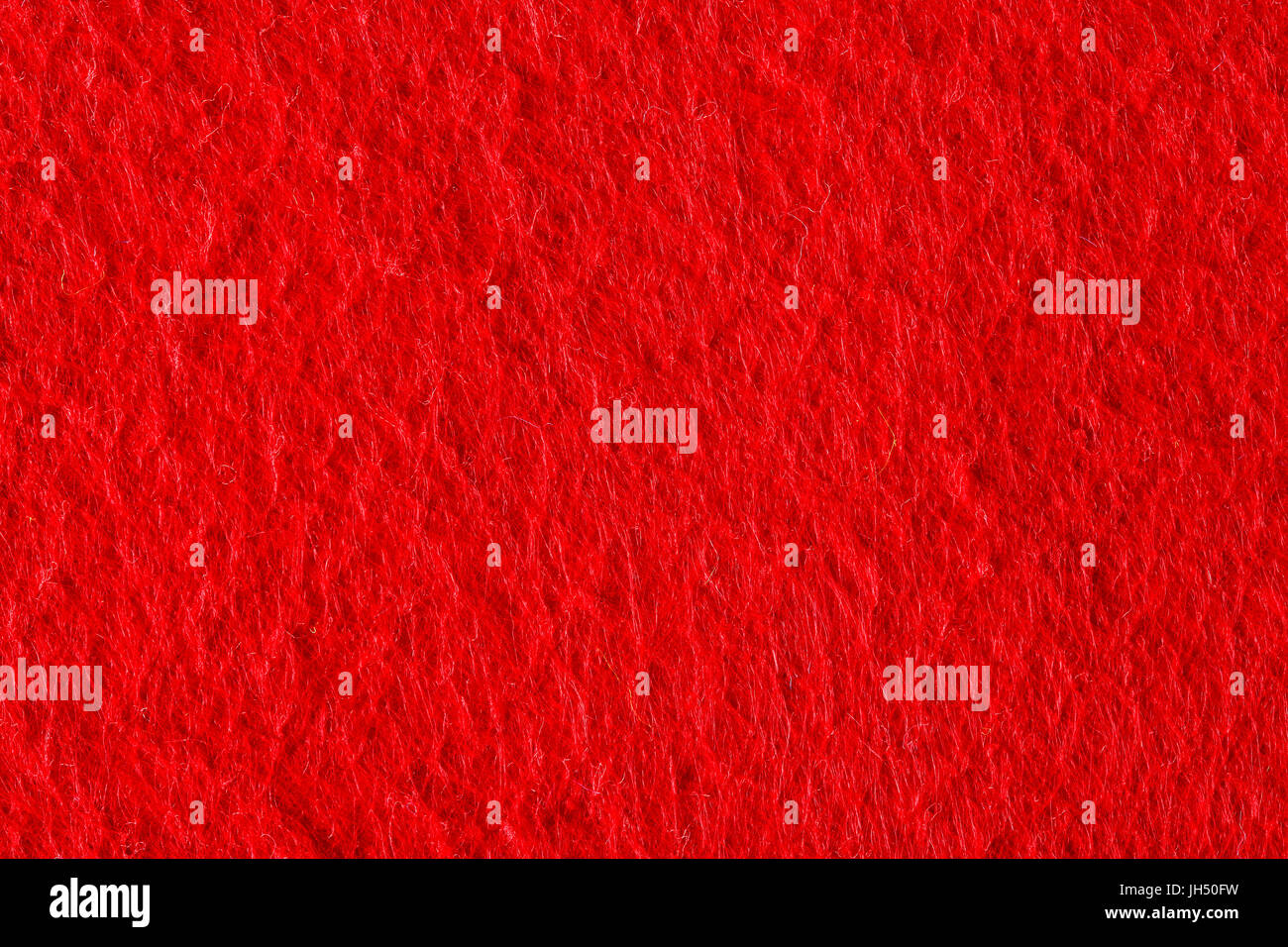 Abstract background with red felt texture, velvet fabric. Stock Photo