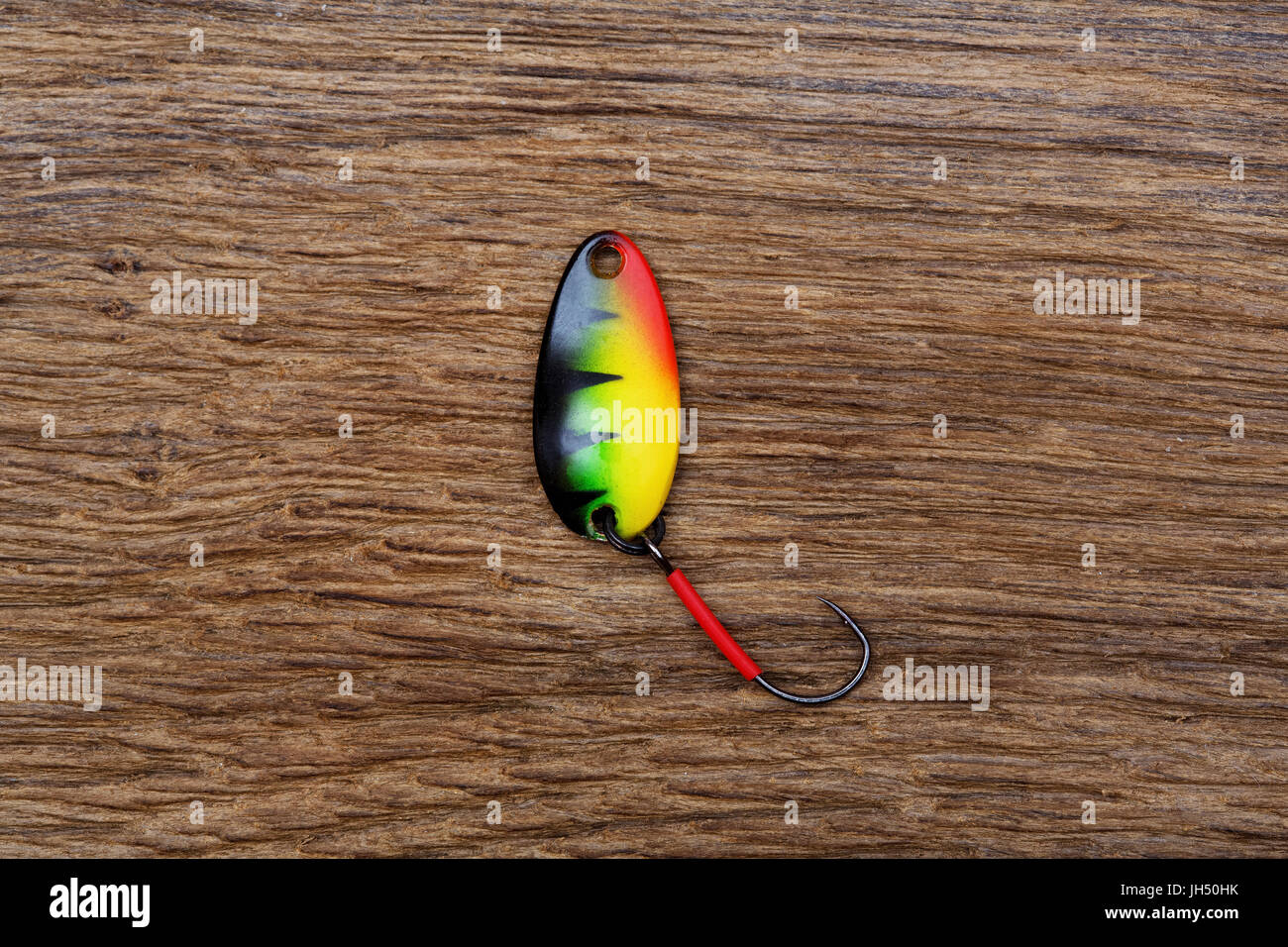 Fishing lure on the old wooden table. Stock Photo
