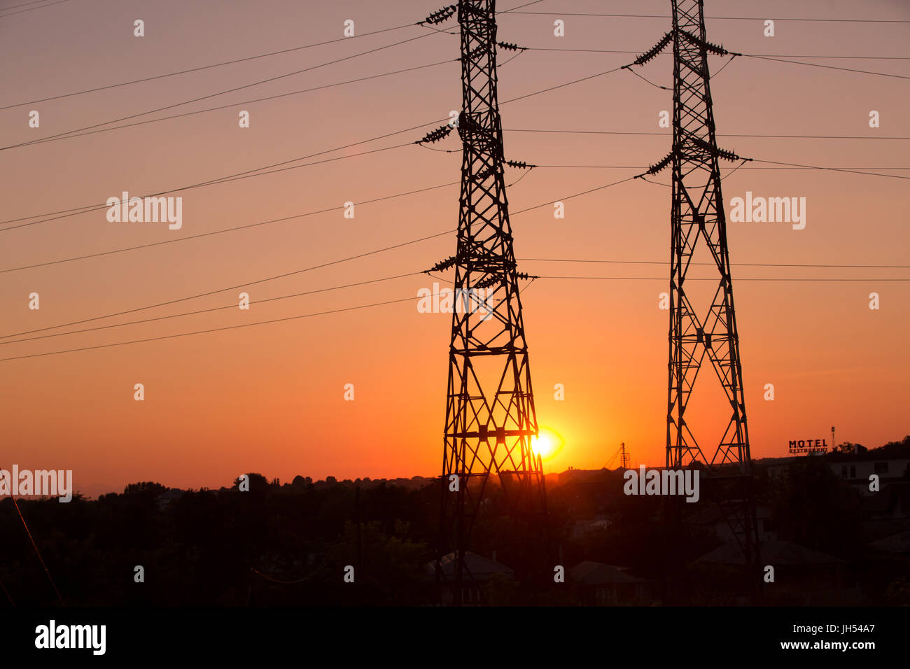 High voltage transmission power line silhouette on sunset Stock Photo ...