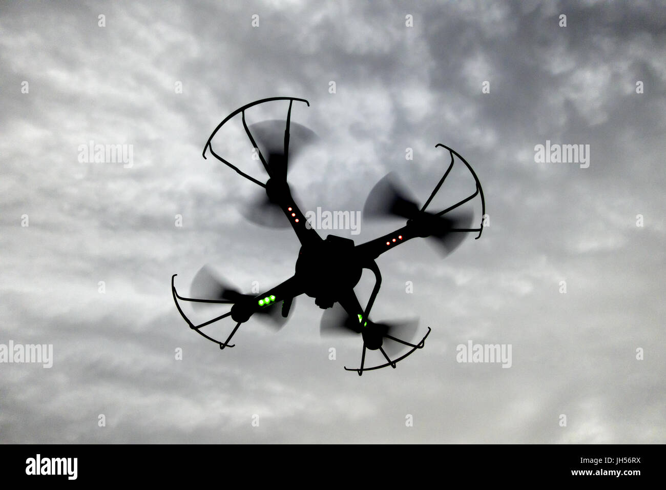 myg endnu engang hastighed A drone flying in dark clouds with red and green lights. Concept of  diffucult times Stock Photo - Alamy