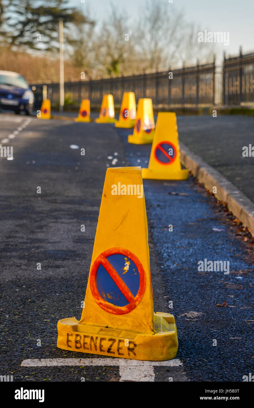 Police 'No Waiting' traffic cones in rural town setting. Wales. UK Stock Photo