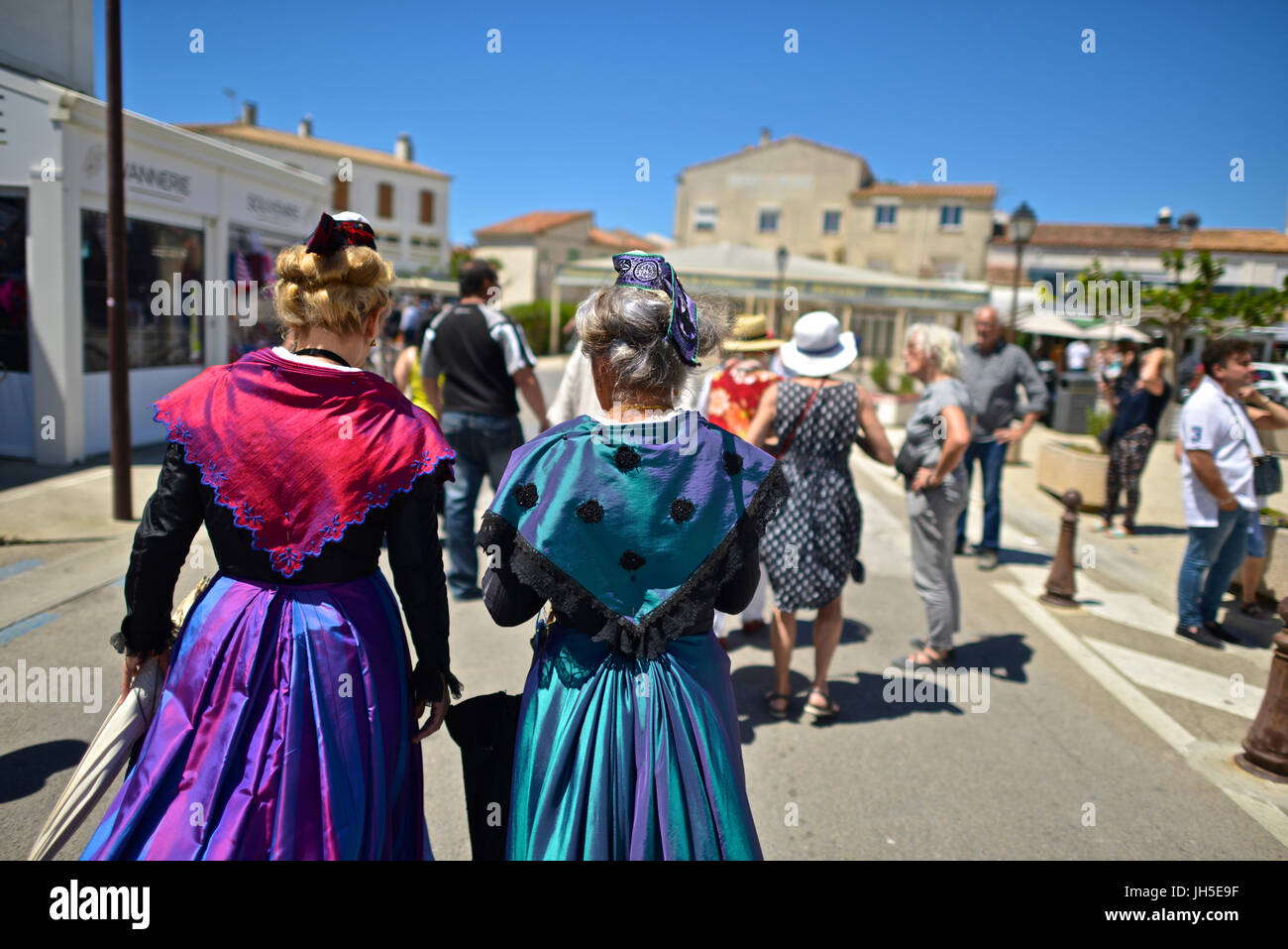Arlésienne women in costume at the procession of the Saints Mary Jacobe and Mary Salome. Stock Photo
