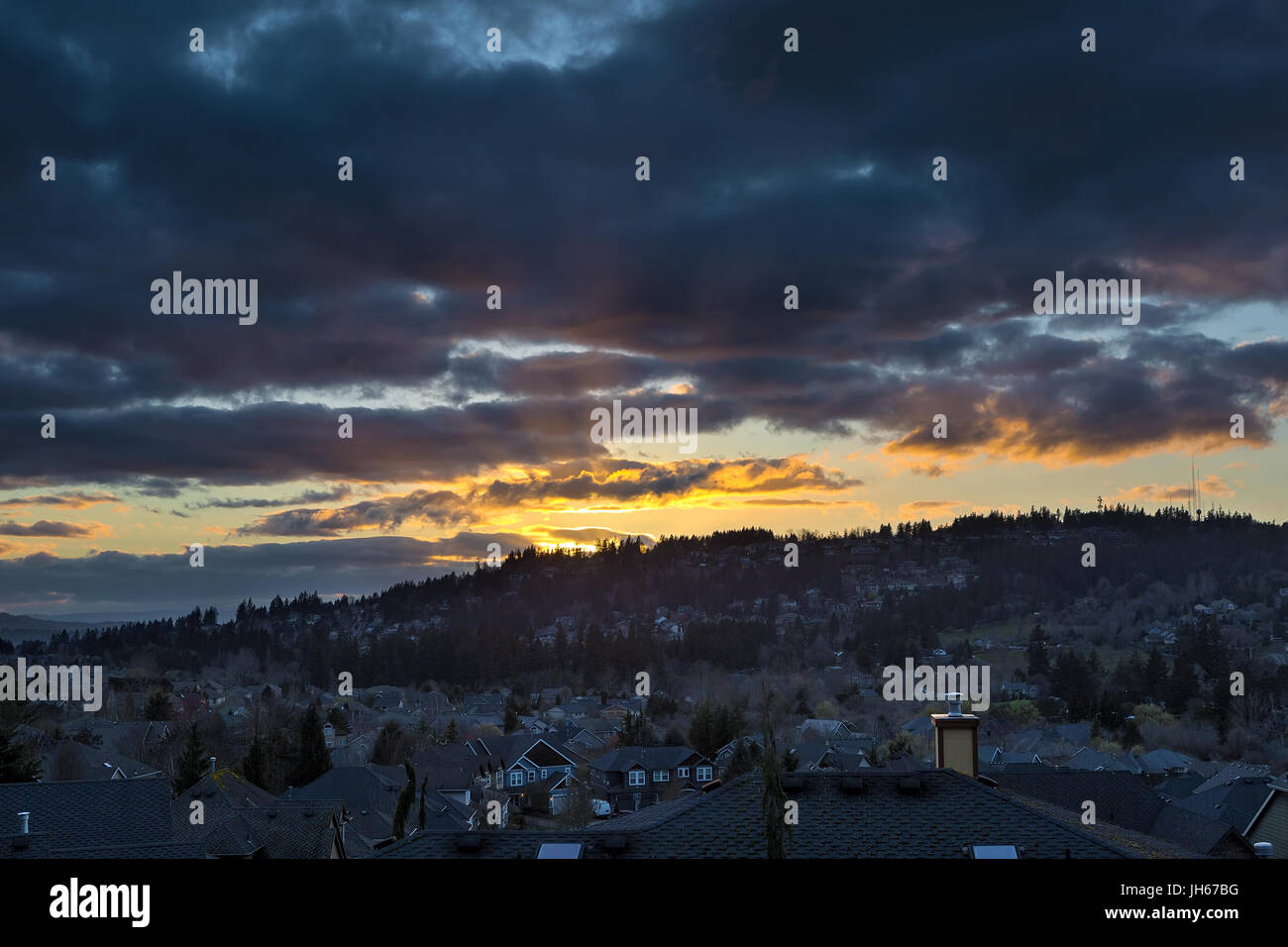 Stormy sky over Happy Valley Oregon residential suburban neighborhood during sunset Stock Photo