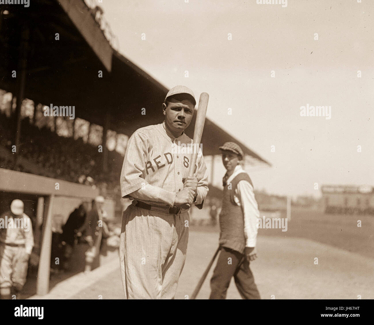 Babe Ruth takes the field while playing for the Boston Red Sox in 1919. George Herman 'Babe' Ruth Jr. (February 6, 1895 – August 16, 1948) was an American professional baseball player whose career in Major League Baseball (MLB) spanned 22 seasons, from 1914 through 1935. Nicknamed 'The Bambino' and 'The Sultan of Swat', he began his MLB career as a stellar left-handed pitcher for the Boston Red Sox, but achieved his greatest fame as a slugging outfielder for the New York Yankees. Ruth established many MLB batting (and some pitching) records. Stock Photo