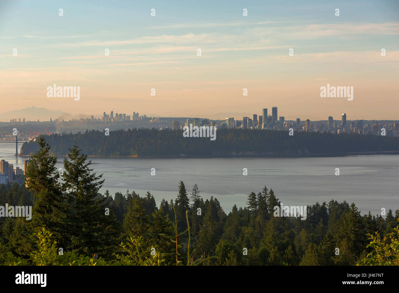 City skyline view of Vancouver and Burnaby by Stanley Park during sunrise Stock Photo