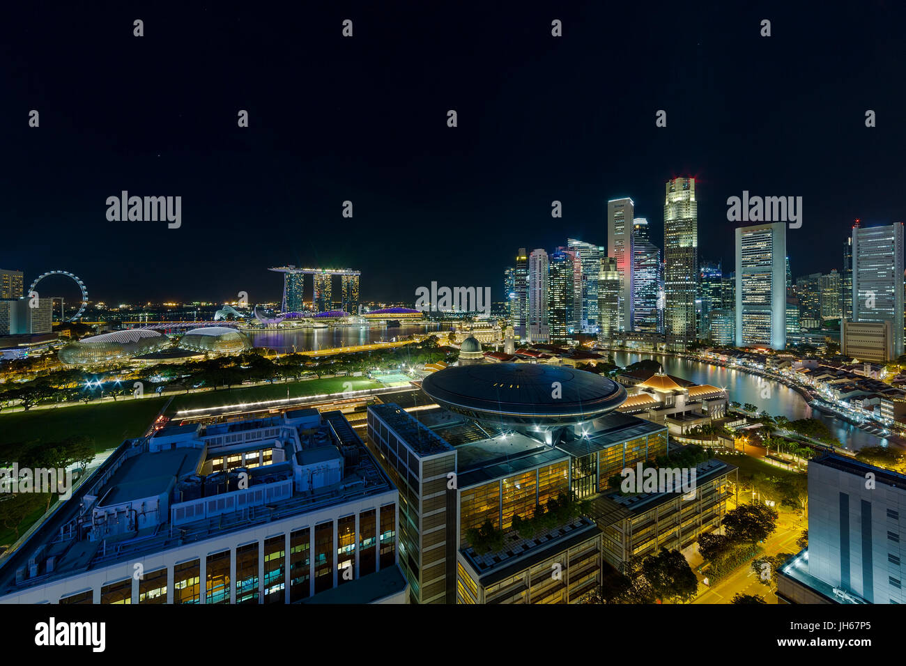 Singapore Central Business District CBD city skyline by Boat Quay along Singapore River during evening twilight blue hour Stock Photo