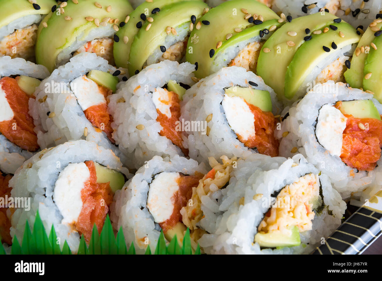 https://c8.alamy.com/comp/JH67YR/sushi-roll-platter-with-crab-smoked-salmon-avocado-cream-cheese-platter-JH67YR.jpg