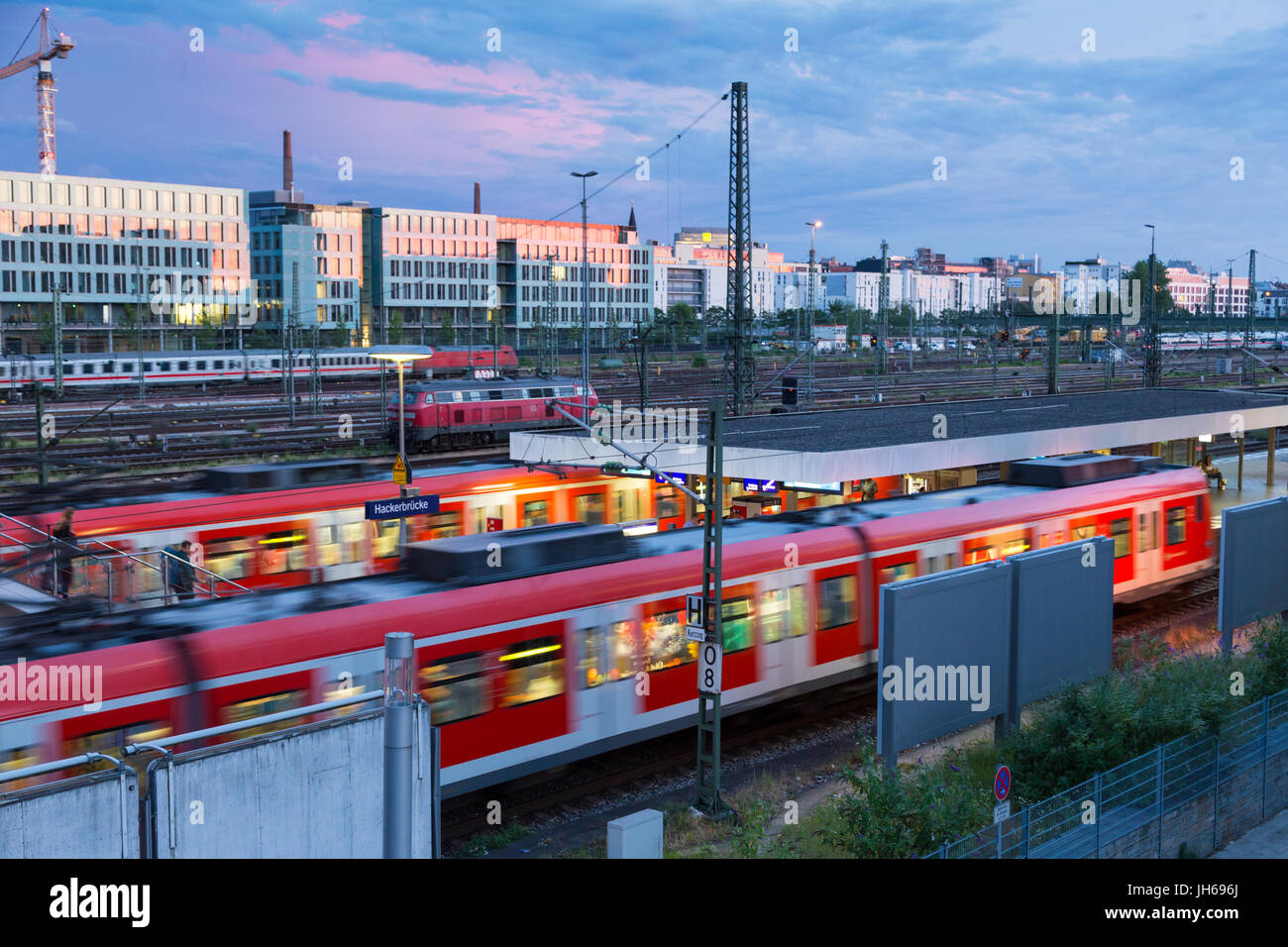 Railway with trains on Hackerbrucke train and S-bahn station in Munich, Germany Stock Photo