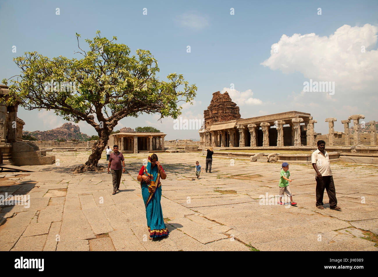 Indian people visiting Vijaya Vittala Temple, Hampi, Karnataka, India Stock Photo