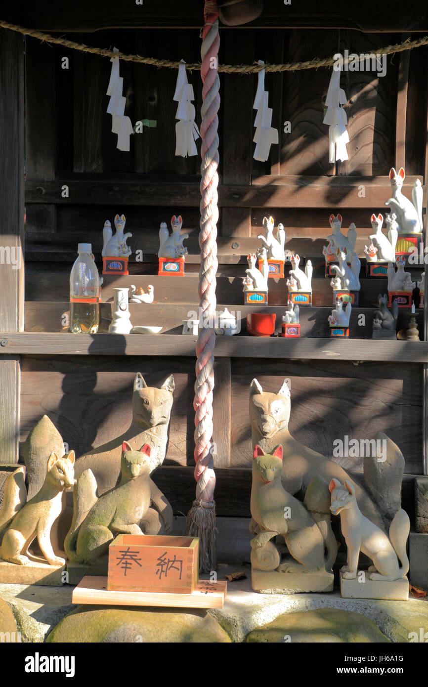 Fox Statues at Inari Shrine of Kumagawa Jinja Shinto Shrine in Fussa city Tokyo Japan Stock Photo
