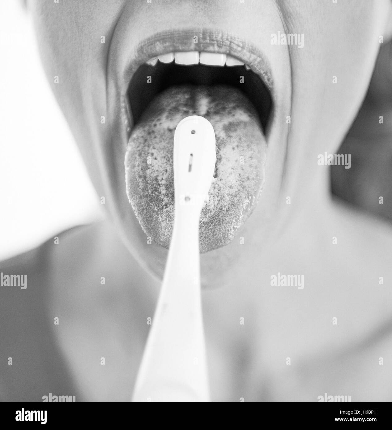 Clean teeth woman tongue Black and White Stock Photos & Images Alamy