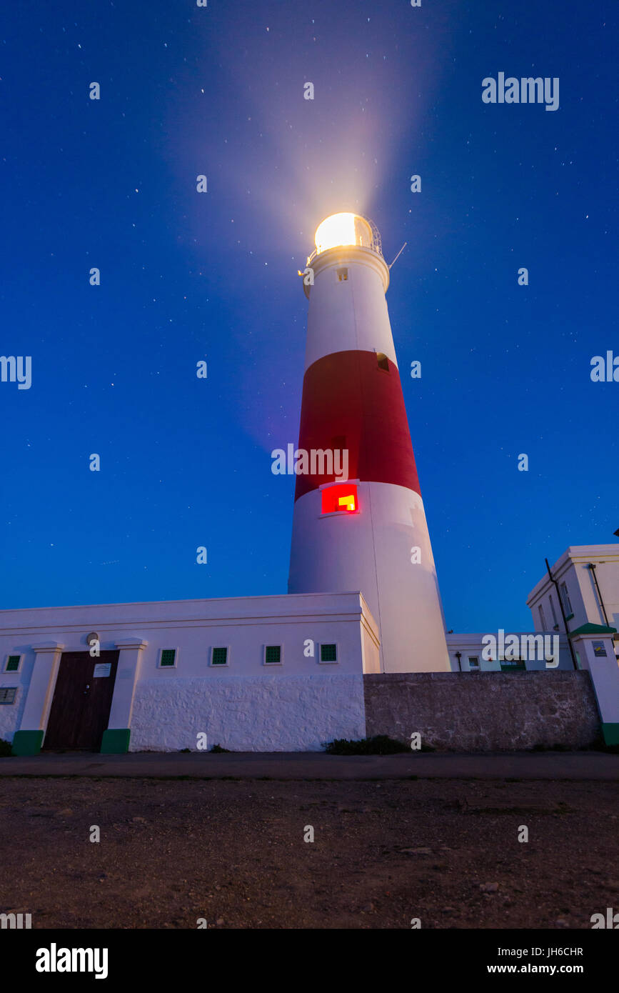 Stars above the iconic lighthouse at Portland Bill on a clear spring night along the Jurassic Coast in Dorset, England, UK Stock Photo