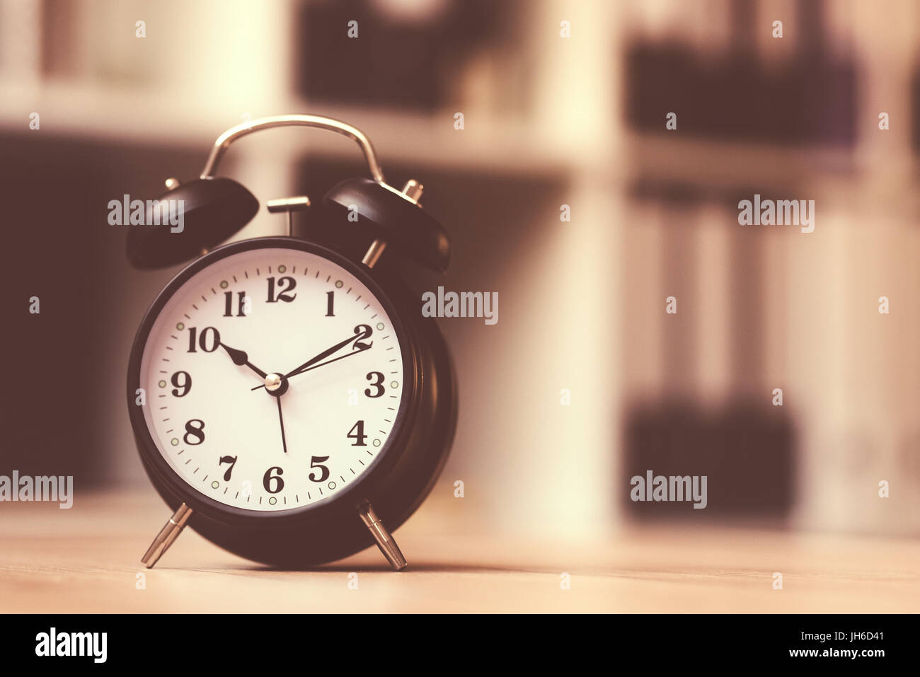 Classic alarm clock showing time during working hours or work break in