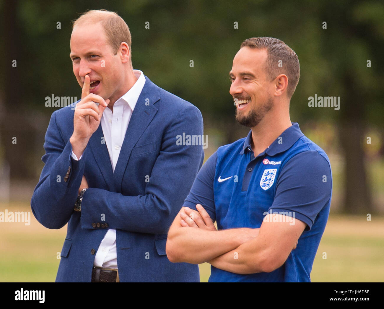 The Duke of Cambridge with England Women football team manager Mark Sampson during a reception for the England Women football team at Kensington Palace in London. Stock Photo