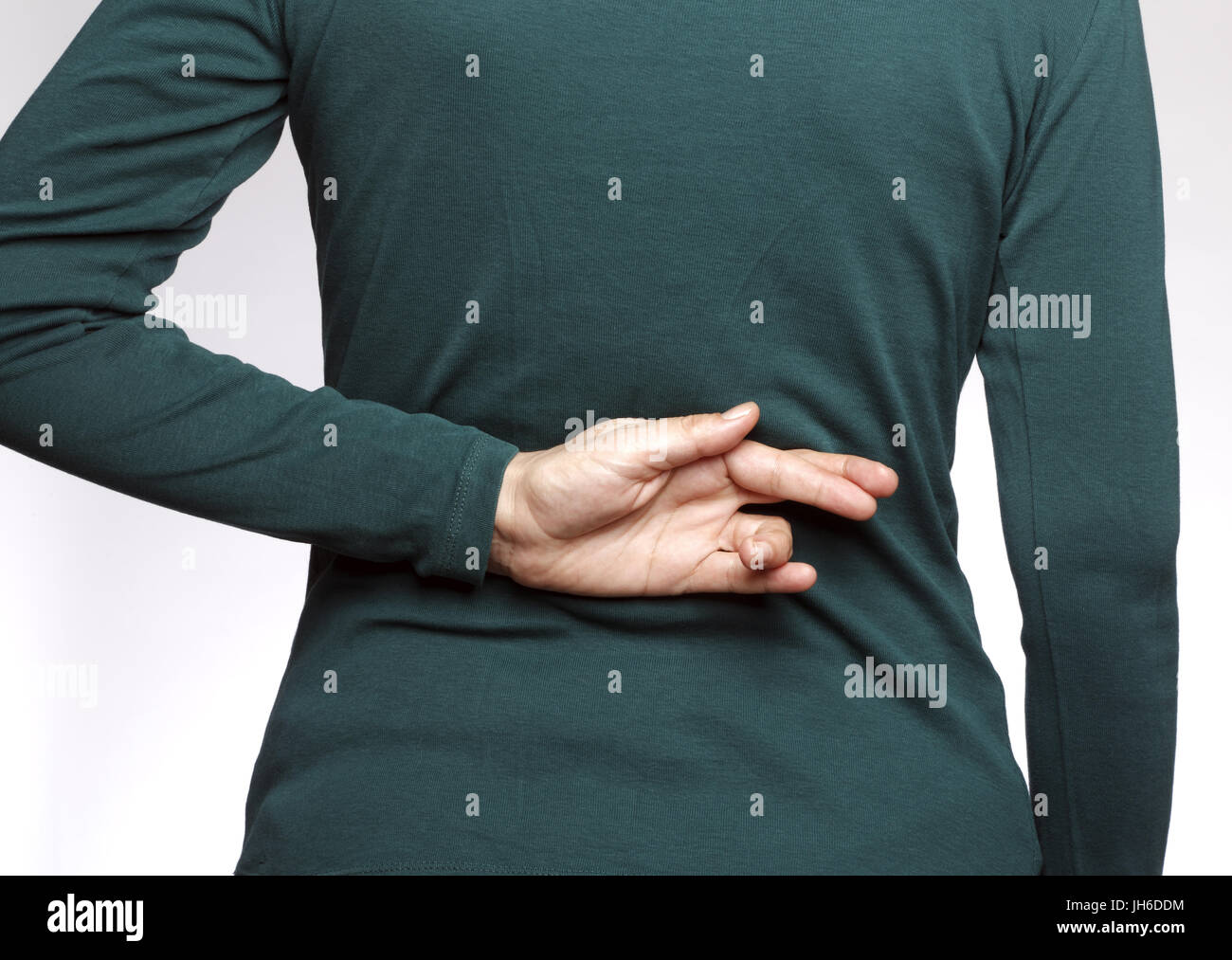 Crossed fingers behind back hi-res stock photography and images - Alamy