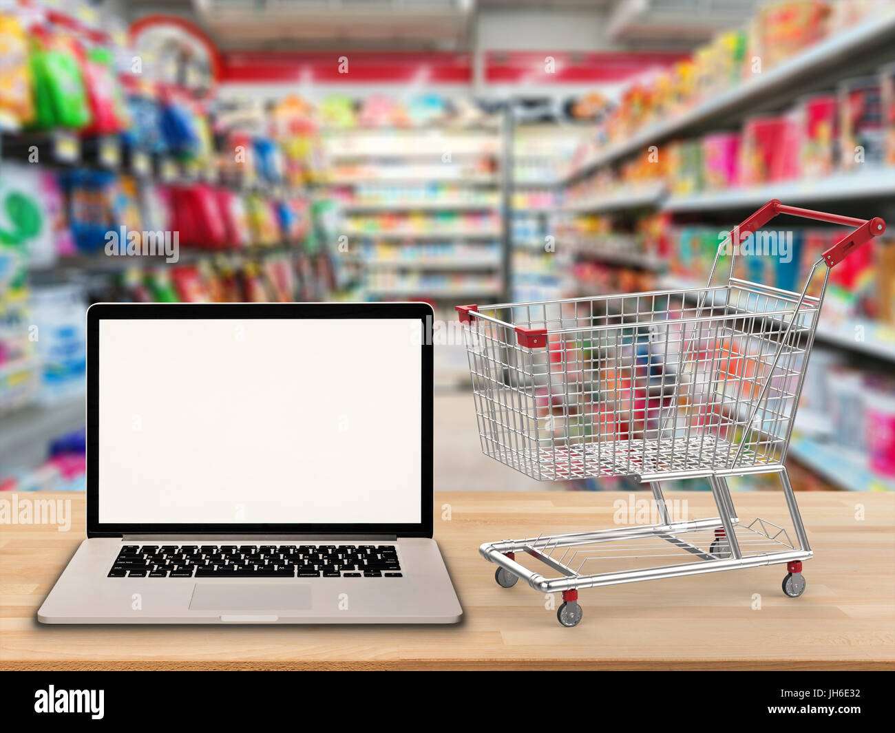blank screen notebook with shopping cart Stock Photo Alamy