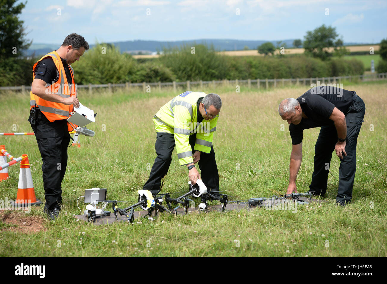 Officers from Devon & Cornwall and Dorset Police check drones and equipment, as they launch the first fully operational drone unit used by police at Westpoint Arena in Clyst St Mary, near Exeter, in co-operation with Dorset Police. Stock Photo