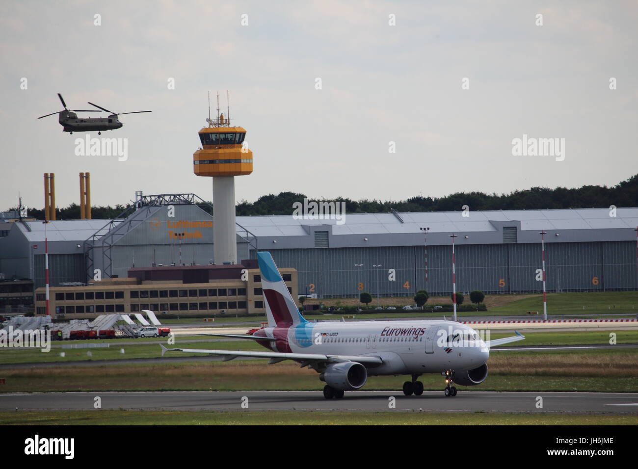 An airplane and a US military helicopter on the Helmut Schmidt Airport in Hamburg during the G20 summit Stock Photo