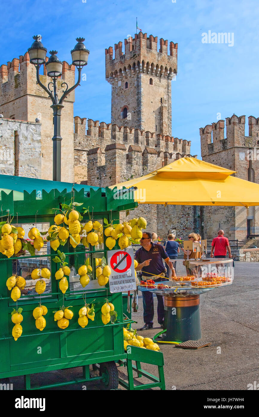 Lemon for sale and Scaliger castle in the background Stock Photo