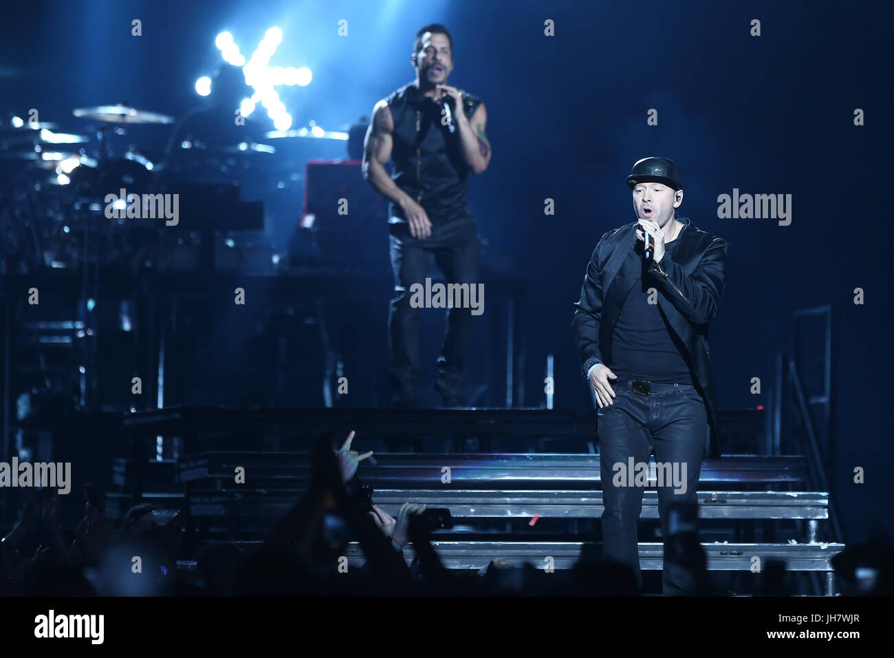 NEW YORK-JUL 7: Danny Wood (L) and Donnie Wahlberg of New Kids on the Block perform during The Total Package Tour at NYCB Live at the Nassau Veterans  Stock Photo