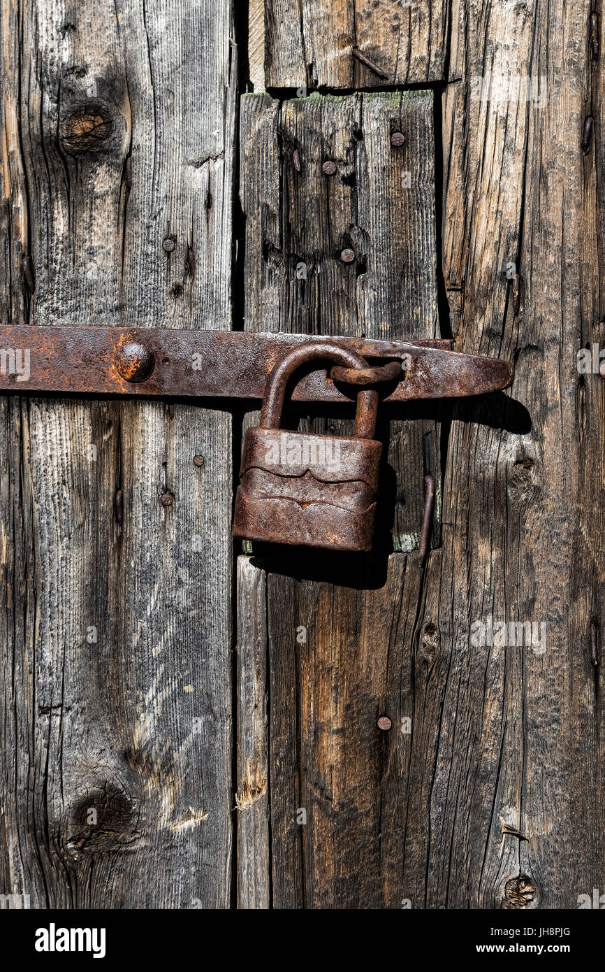 Old wooden door with rusty padlock Stock Photo - Alamy