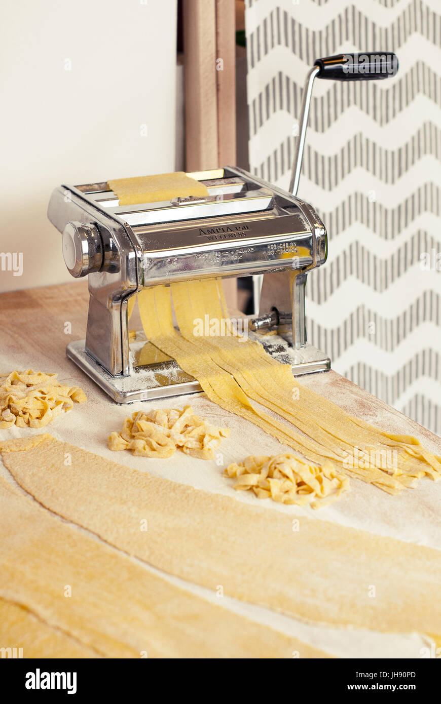 https://c8.alamy.com/comp/JH90PD/homemade-pasta-with-eggs-made-on-a-pasta-maker-it-has-enogh-room-on-JH90PD.jpg