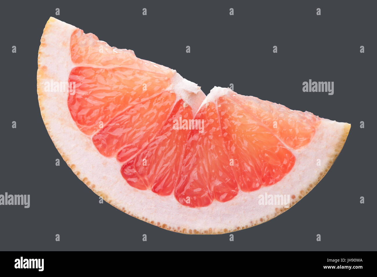 Parts of grapefruit on dark background. Studio shot retouched Stock